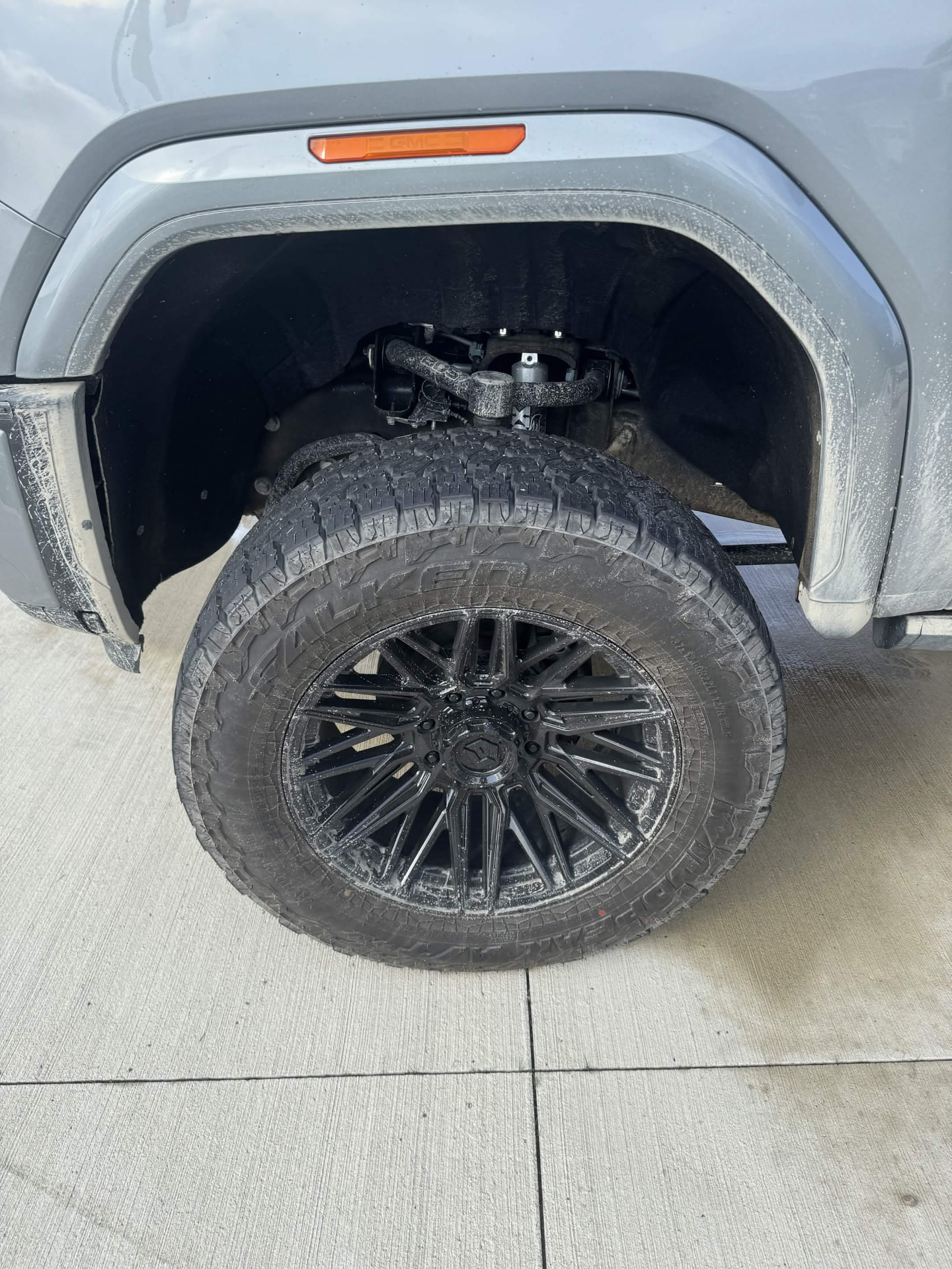 Dirty truck wheel and tire before detailing